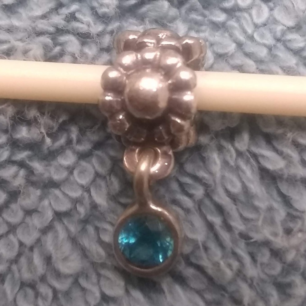 Pandora flower charm with teal stone dangle